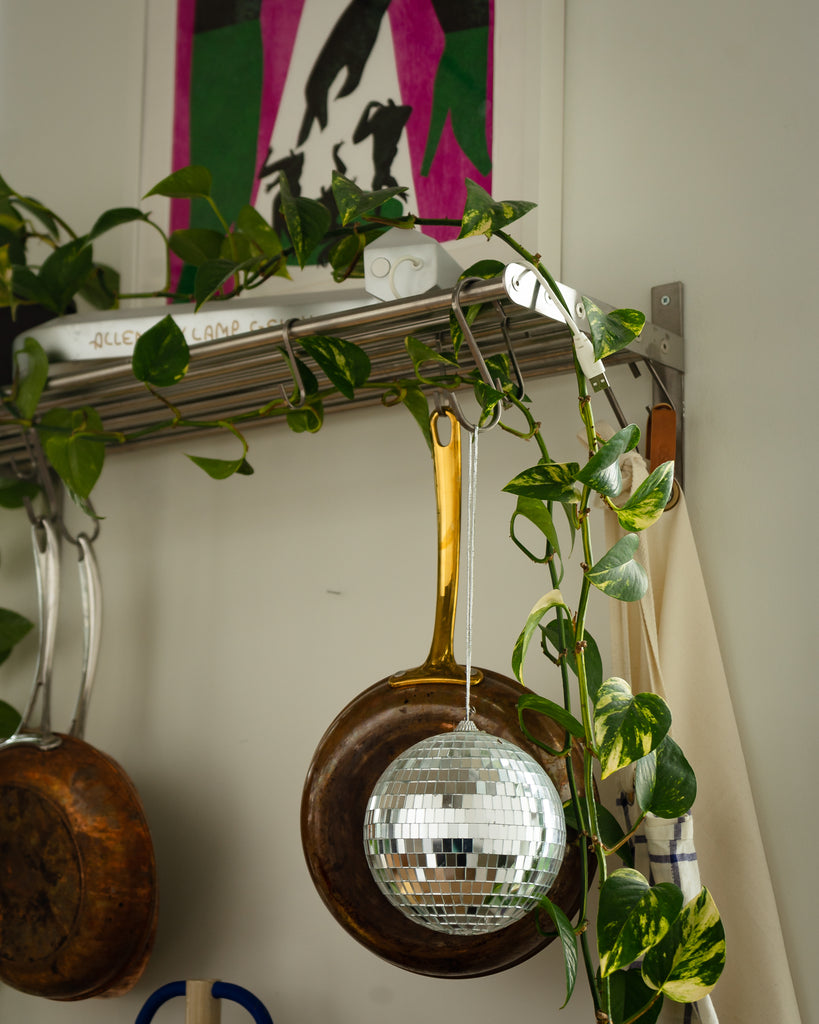 Small details like this disco ball are sprinkled throughout the home.