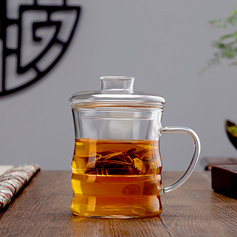 vue de face d'une tasse en verre moderne avec du thé au jasmin et des  brindilles de plantes. théière avec thé infusé et fleurs d'asmine. fond de  ciment gris. 12876730 Photo de stock chez Vecteezy