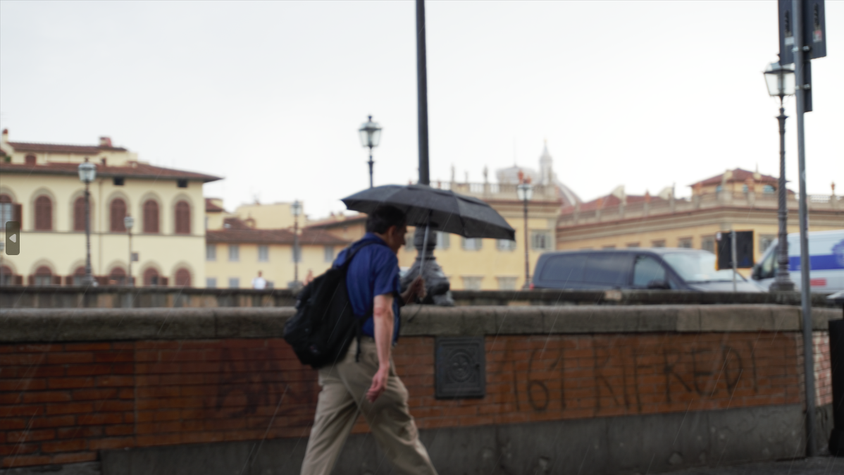 MAN WALKING IN RAIN