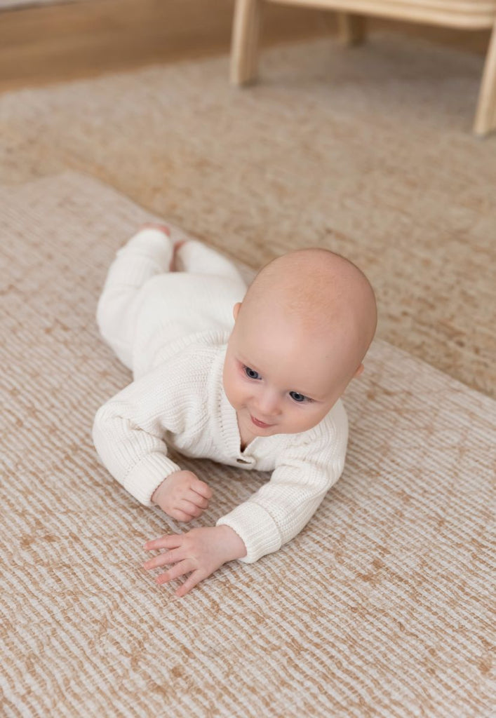 An easy to clean and padded foam play mat for tummy time
