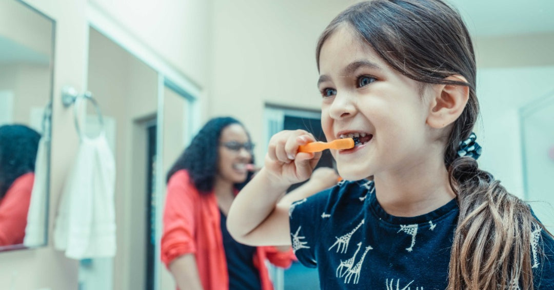 girl brushing teeth