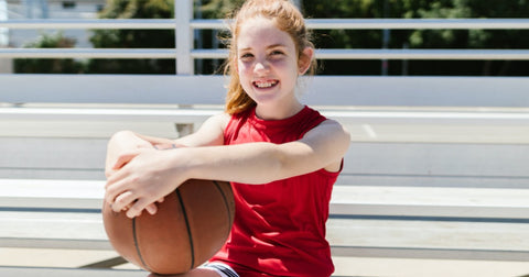 girl playing basketball