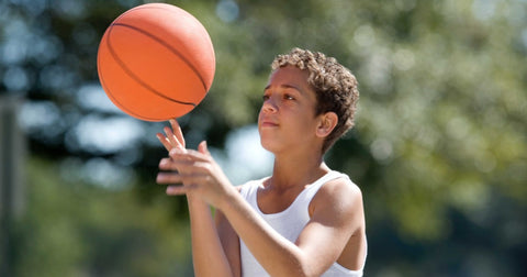 boy playing basketball