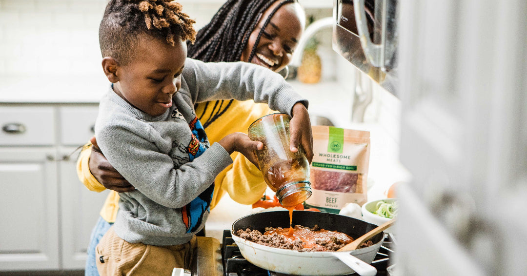 boy cooking with mom