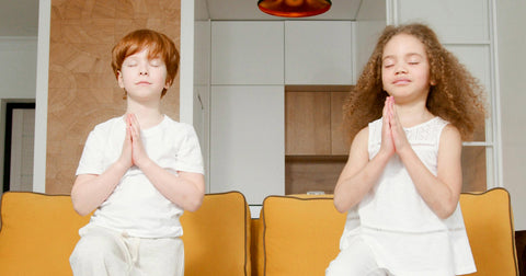 children in yoga pose