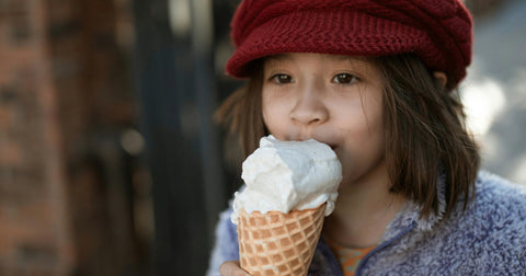 girl eating ice cream cone
