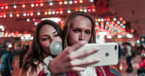 girls blowing bubbles