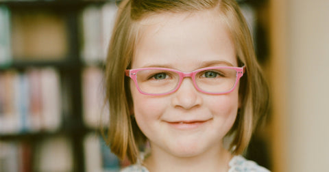 little girl in glasses