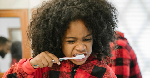 girl brushing teeth