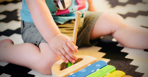 toddler playing with toy