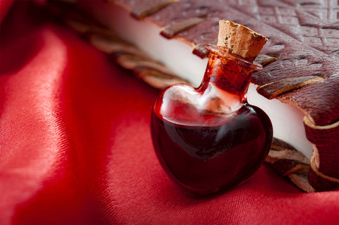 Heart shaped vial of love potion created from damiana