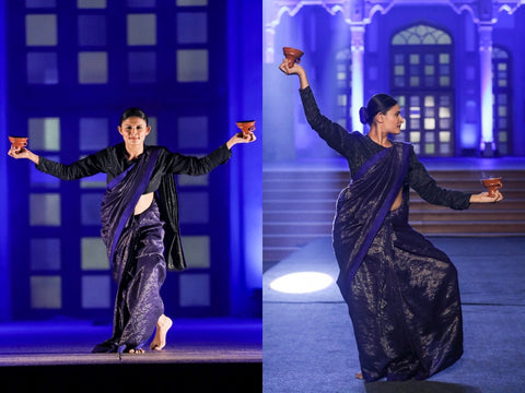 "Elegant portrayal of Dhunuchi Naach: A woman adorned in a saree from the Shunyata Collection by Karomi, gracefully performing the traditional dance. The garment's experimental jamdani design enhances the cultural elegance of the Dhunuchi Naach, celebrating the fusion of tradition and contemporary allure in this captivating moment."