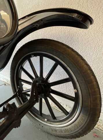 The wheel of a model T car