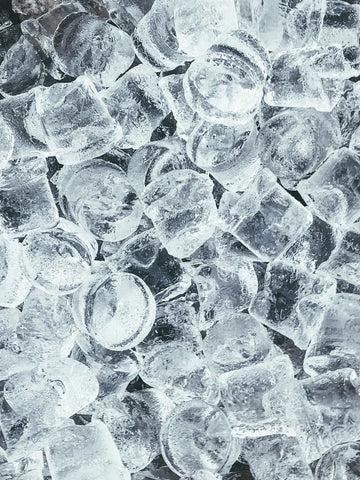 A close-up of round ice cubes.