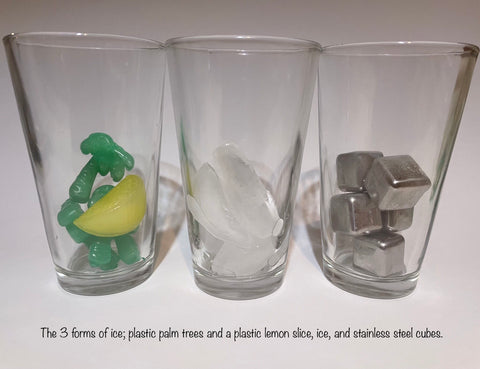 3 forms of ice; plastic palm trees and a plastic lemon slice, ice, and stainless steel cubes.