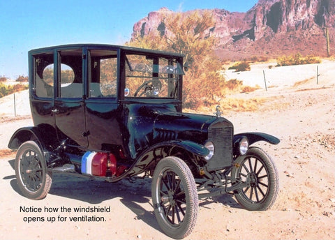 A Model T car painted black with the door open. Caption reads 'Notice how the windshield opens up for ventilation'.