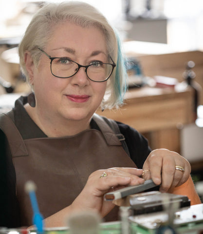 Helene Campbell of Tall Trees Studio at her jewellers bench
