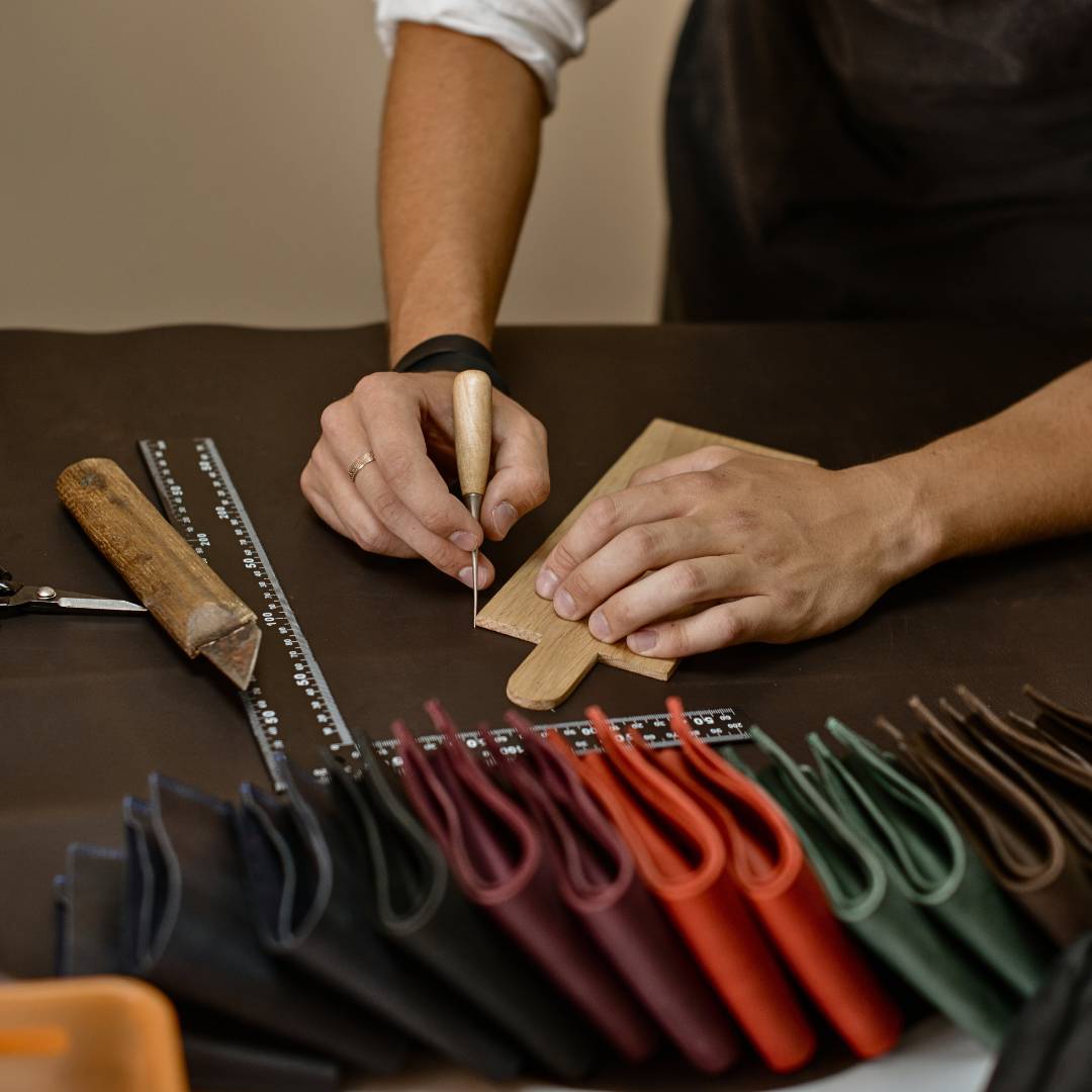 A man in the factory produces Gentcreate leather products.