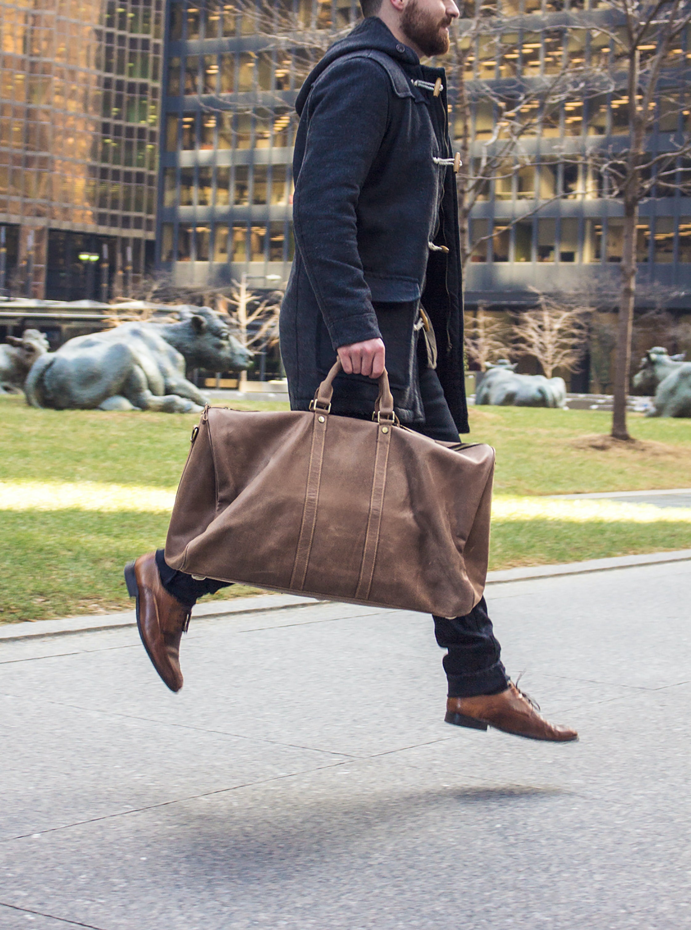 Man Holding PU Leather Dark Brown Duffle Bag