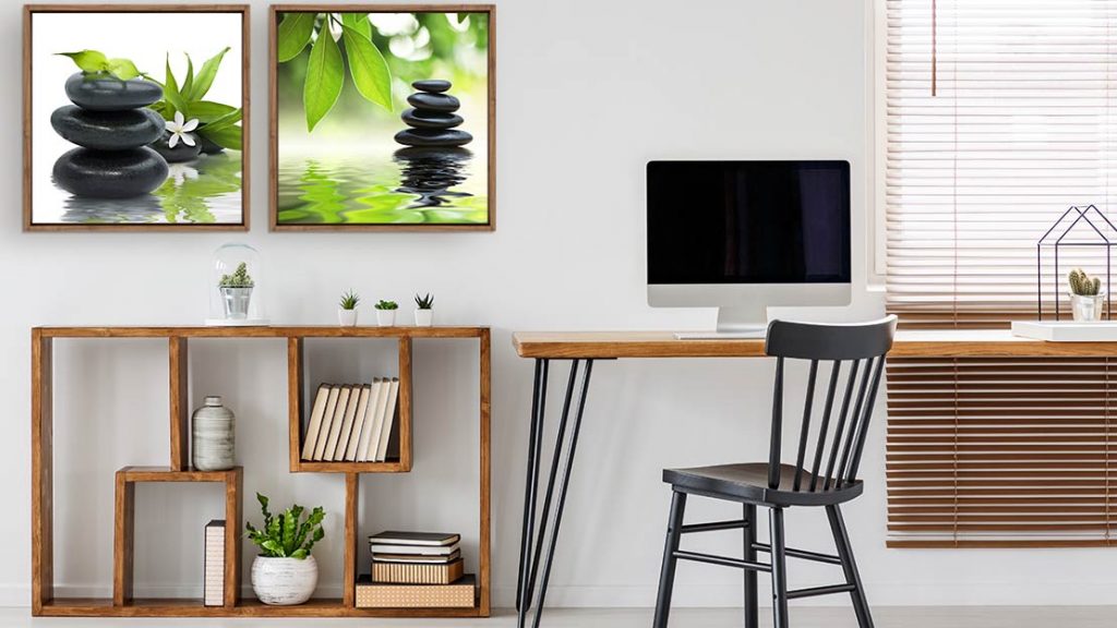 Motivating wall art prints next to computer screen