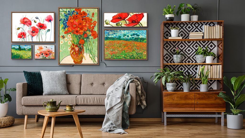 Wall art placed together in a living room with plants