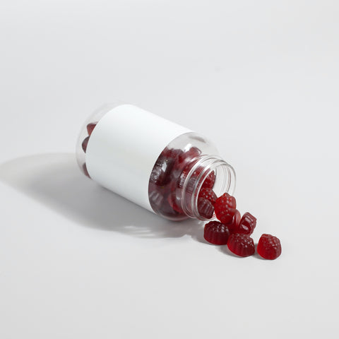 red collagen gummies spilling out of a bottle