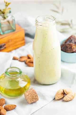 glass bottle filled with smoothie ingredients