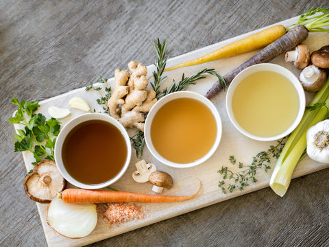 three different coloured herbal teas on a platter