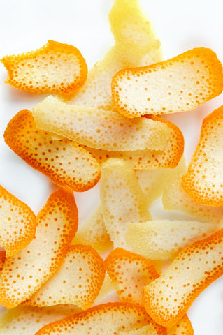 orange peels on white background