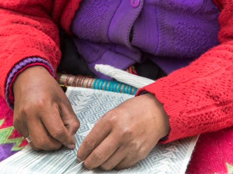 woman's hands weaving