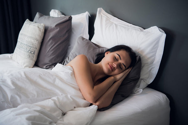 Woman sleeping in a bed