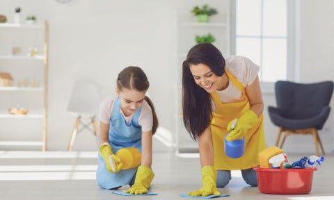 Mom and daughter cleaning their home