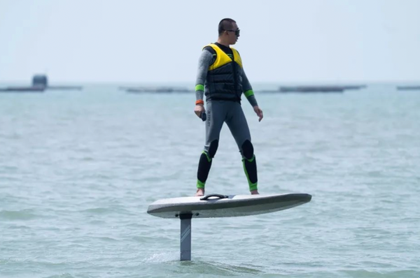 A 50-year-old man is riding a Waydoo Flyer One efoil to cross the strait