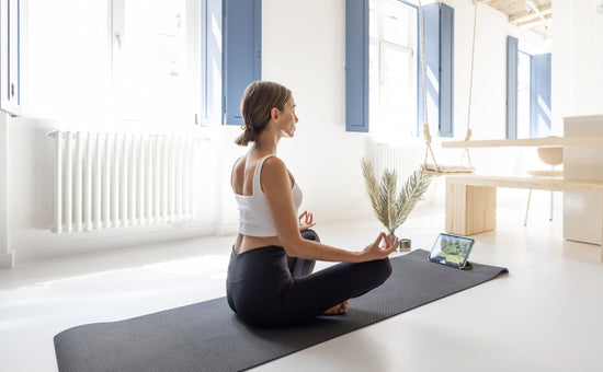 Young woman practicing meditation in a serene indoor setting