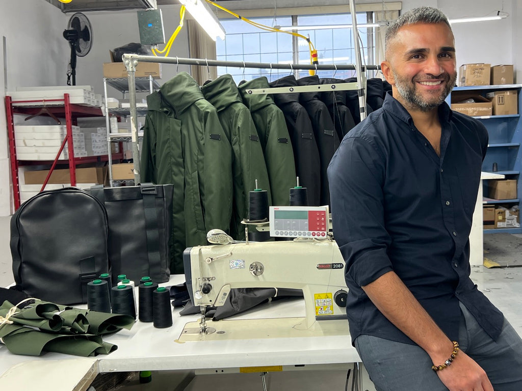 inder in his factory back faing his warehouse, equipement and outerwear creations.