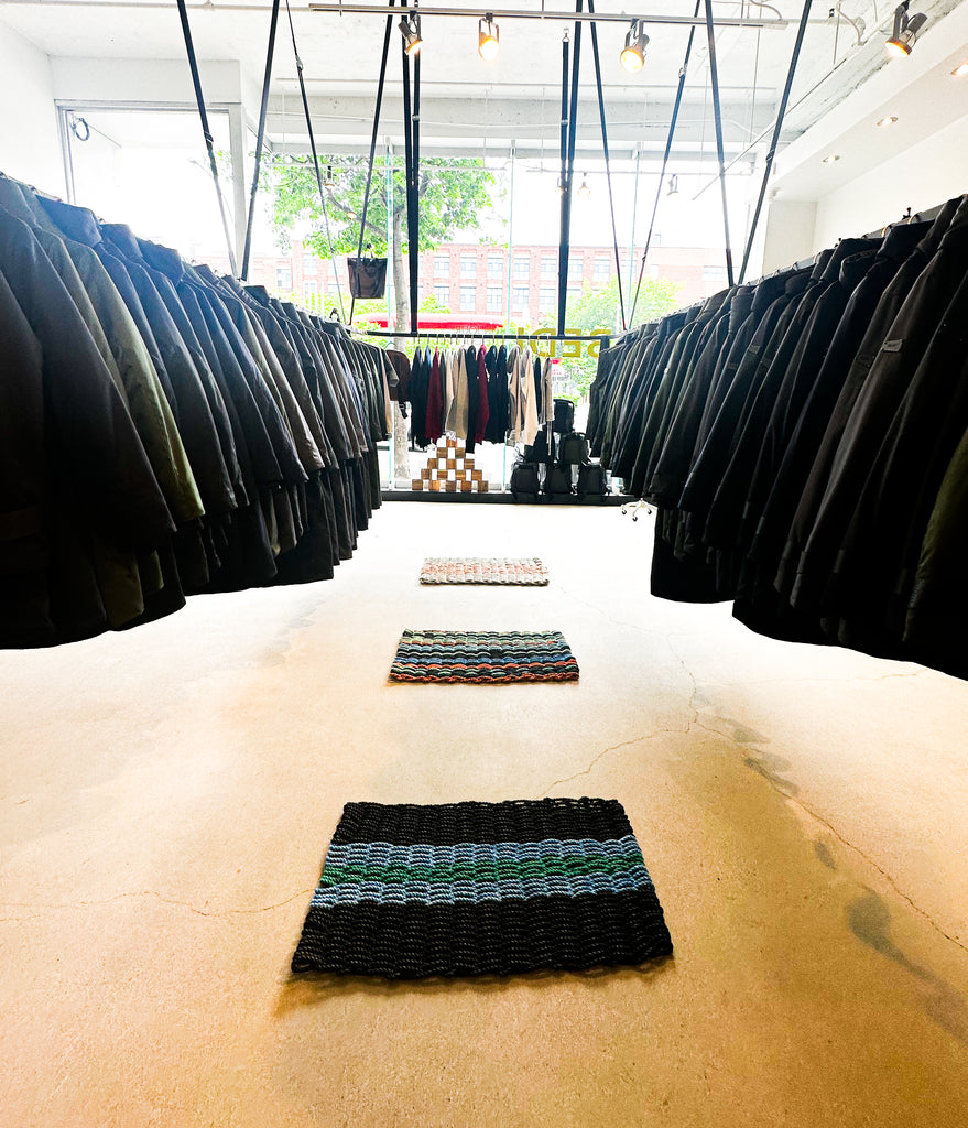 architectural design inside of the bedi studios flagship store featuring woven fishnet carpets