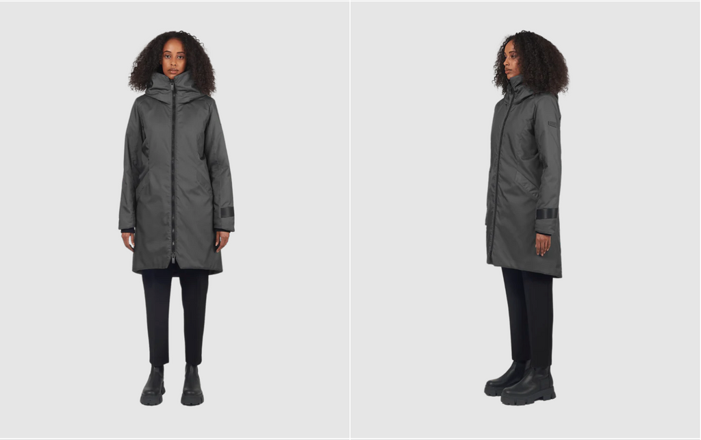 two images in one of the same female model wearing a graphite 3/4 parka facing the camera (left) and side facing camera (right) on a grey background