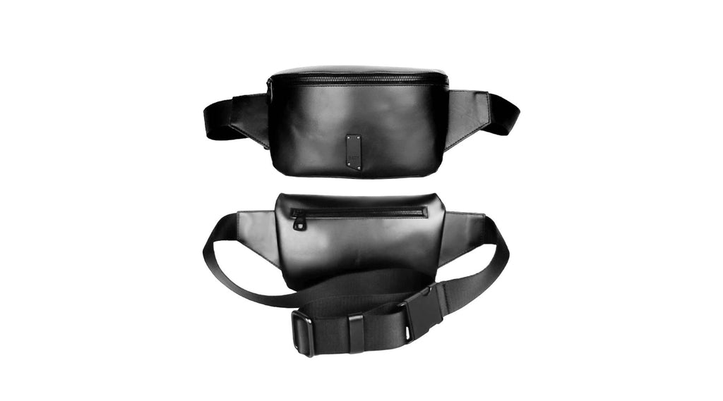 flat lay showcasing the front and back of a black utilitarian fanny pack on a white background