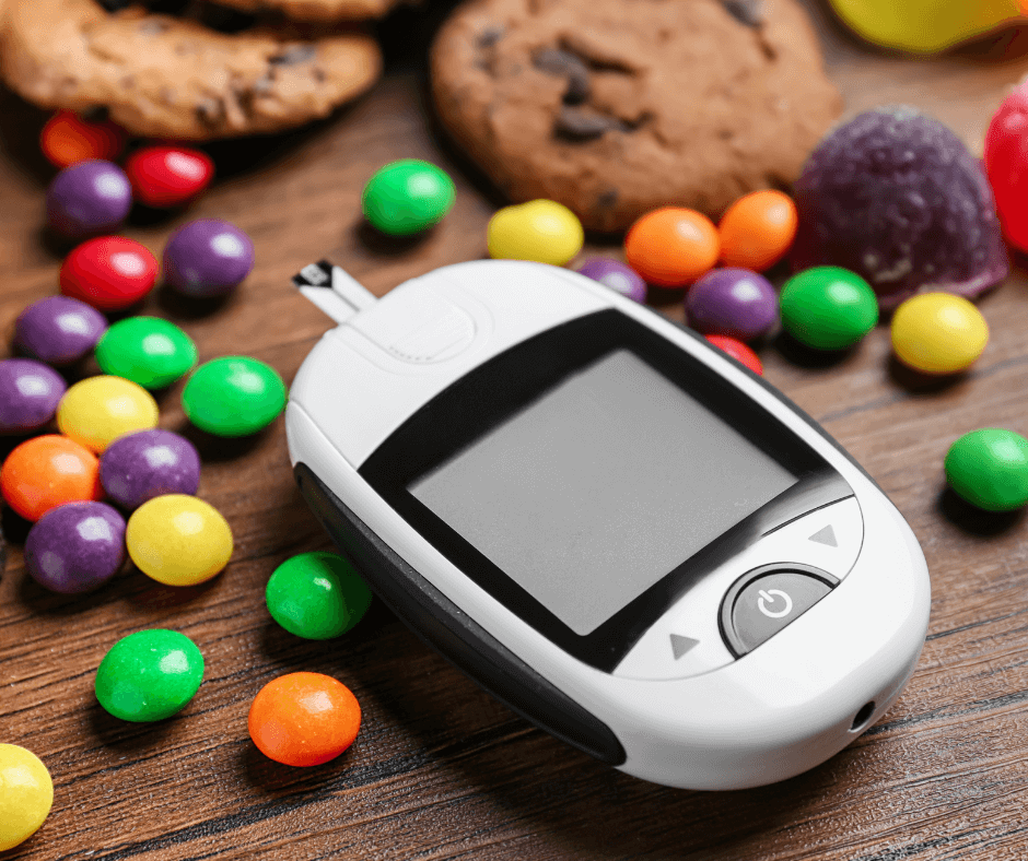 Glucose meter and candies and biscuits