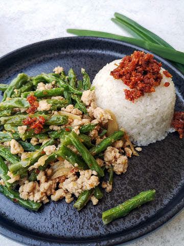 Chicken and green bean stir fry served with coconut pandan sticky rice