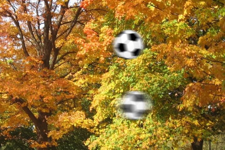 Two different frame rates represented by the motion blur of soccer balls