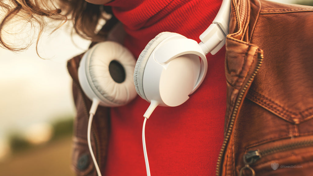 closeup of positive person feeling happy bright colors and headphones