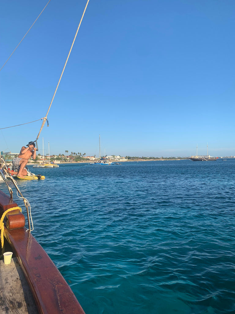 Jack swinging off the pirate boat in Aruba