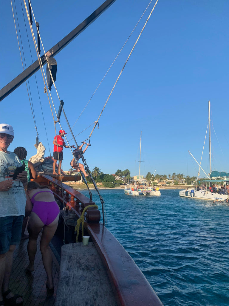 Jennifer swinging off the pirate boat in Aruba