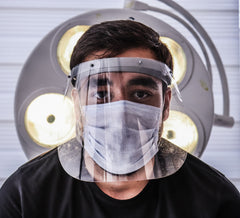 man wearing a 3-ply mask and a plastic face shield