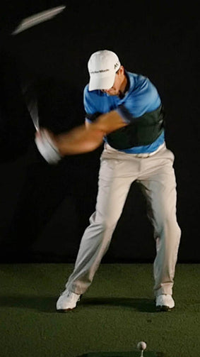 golfer mid-swing using Swing Jacket golf training aid showing how he creates impressive lag and swing speed 