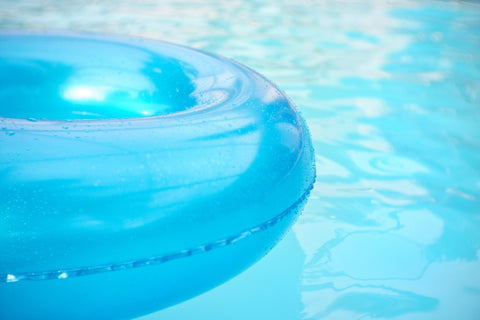 A pool floating donut inside of a pool