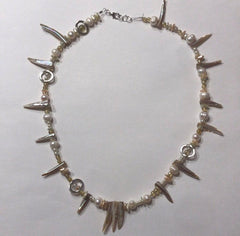 Necklace with strung pearls and spiked beads