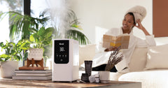 Woman with Levoit OasisMist 450S Humidifier