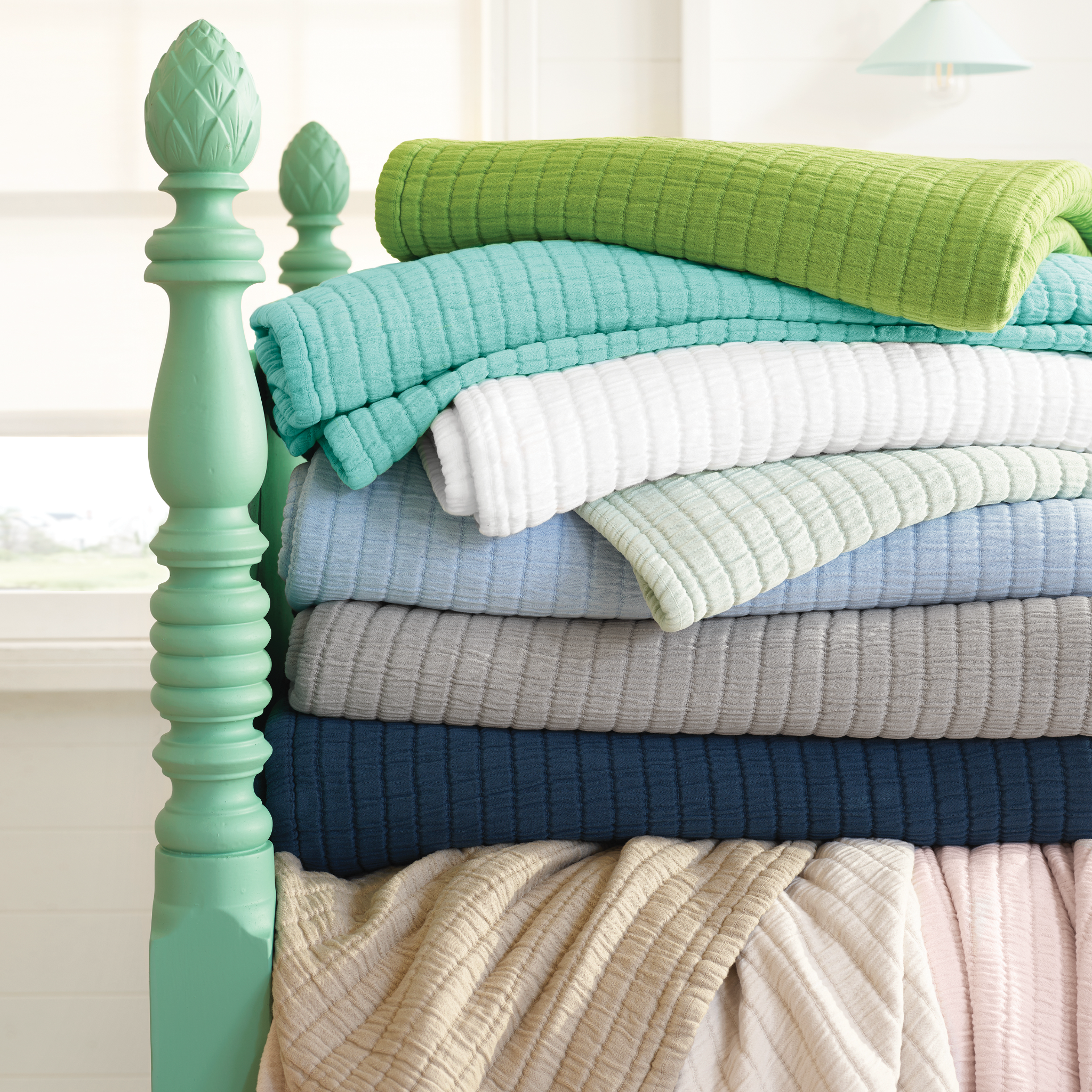 Stack of Different Colored Pine Cone Hill Boyfriend Matelassé Coverlets